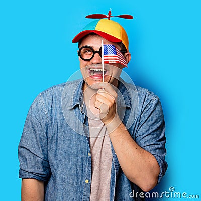Nerd man with noob hat holding an American flag Stock Photo