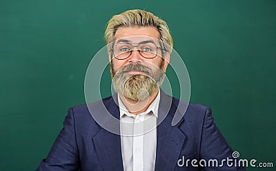 Nerdy genius. Genius man green chalkboard. Genius teacher wear glasses. Brainbox. School and education. Private teaching Stock Photo