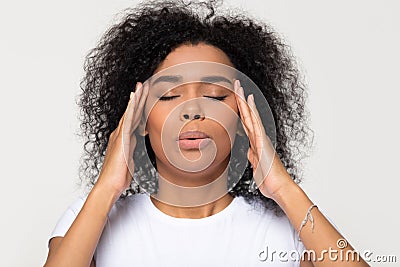 Nervous african woman breathing calming down trying to relieve stress Stock Photo