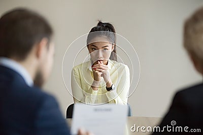 Nervous Asian applicant stressed at job interview Stock Photo