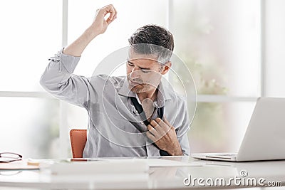 Nervous businessman sweating Stock Photo