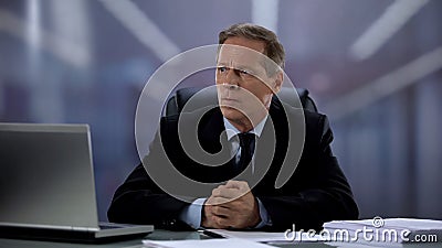 Nervous businessman worrying about important contract, stressed lifestyle Stock Photo