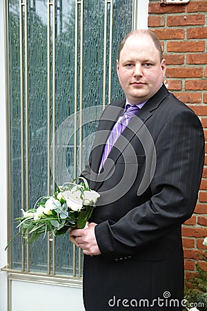 Nervous groom on the doorstep Stock Photo