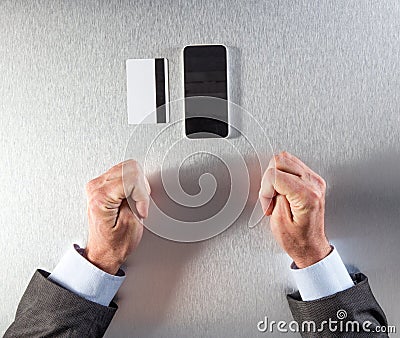 Nervous hands of businessman questioning secure payment on the internet Stock Photo