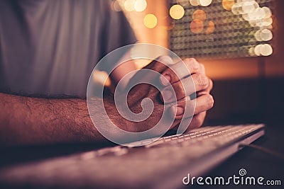 Nervous hands and computer keyboard Stock Photo