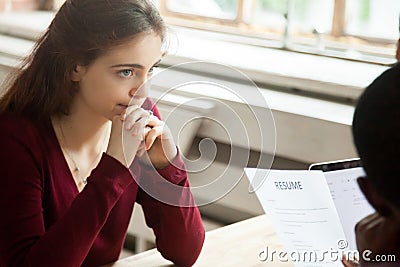 Nervous worried female applicant at job interview, employer read Stock Photo
