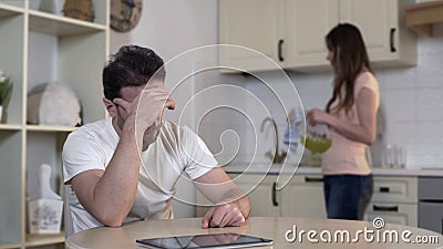 Nervous young woman quarreling with man, annoyed husband ignoring wife, breakup Stock Photo