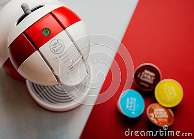 Nescafe Dolce Gusto coffee machine with Nescafe Dolce Gusto capsules. Selective focus Editorial Stock Photo