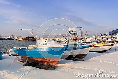 Nesebar, Bulgaria - January 12, 2017: Ships and boats covered in snow in the port of the old town Nessebar on the bulgarian Black Editorial Stock Photo