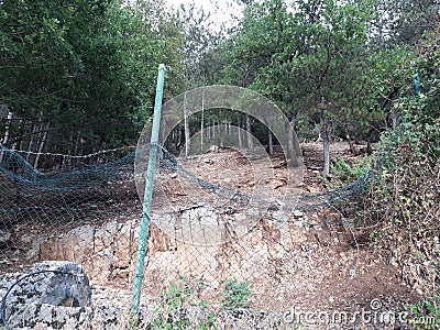 The net of the deer nature reserve has been folded by the passage of the bear. Abruzzo region Stock Photo