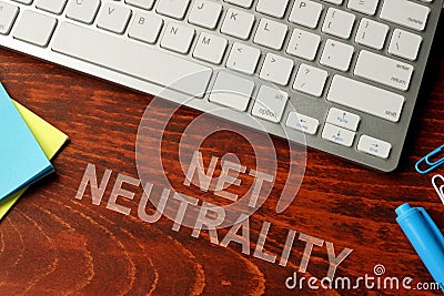 Net neutrality written on a wooden surface. Stock Photo