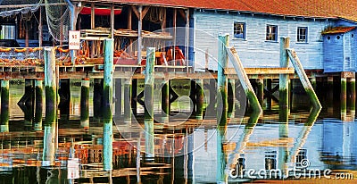 A net shed reflects in the Puget Sound at Gig Harbor Stock Photo