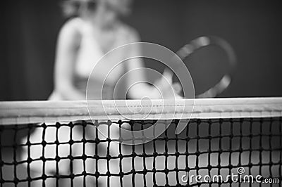 Net of tennis court on blur player background. Black and white Stock Photo
