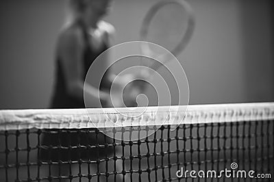 Net of tennis court on blur player background. Black and white Stock Photo