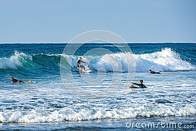 12/18/2018 Netanya, Israel, the surfer rides on the wave and perform tricks on a wave Editorial Stock Photo