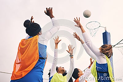 Netball, goal shooting and fitness of a girl athlete group on an outdoor sports court. Aim, sport game and match Stock Photo