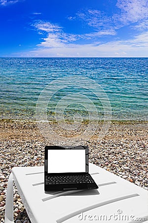 Netbook on beach Stock Photo