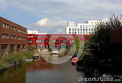 Netherlands, Amsterdam, 350 Eva BesnyÃ¶straat, red housing estate along the waterfront Stock Photo