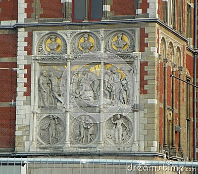 Netherlands, Amsterdam, Stationsplein, Amsterdam Centraal Station, bas-relief on the facade of the building Stock Photo