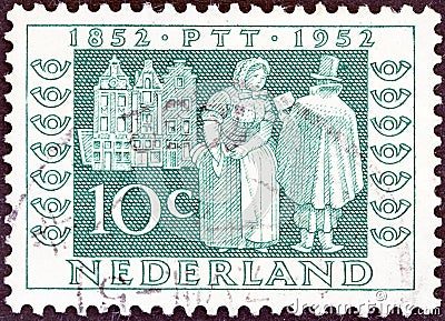 NETHERLANDS - CIRCA 1952: A stamp printed in the Netherlands shows Postman delivering letters, 1852, circa 1952. Editorial Stock Photo