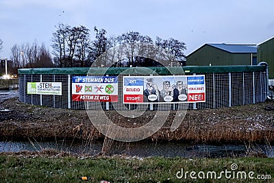 Netherlands, March 2023 -Board with election posters at farm with protest signs and anti coalition banners by angry farmer Editorial Stock Photo