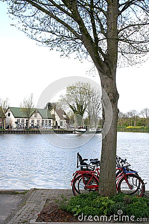Bike parked at Canal in purmerend Stock Photo