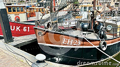 Docked fishing boats and sailboats in the port of Urk. Editorial Stock Photo