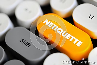 Netiquette is a set of rules that encourages appropriate and courteous online behavior, text concept button on keyboard Stock Photo