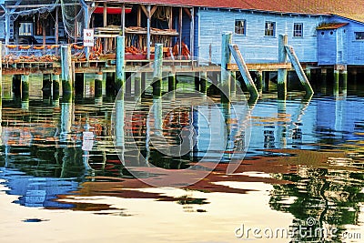 A net shed reflects in the Puget Sound at Gig Harbor Stock Photo