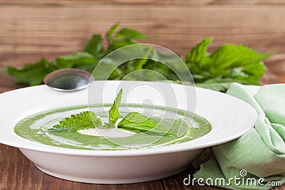 Nettle cream soup with sour cream Stock Photo