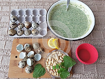 Nettles muffins cooking with quail eggs Stock Photo