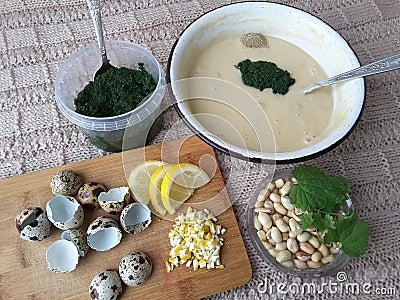 Nettles muffins cooking with quail eggs Stock Photo