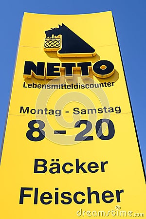 Netto Lebensmitteldiscounter sign against blue sky Editorial Stock Photo