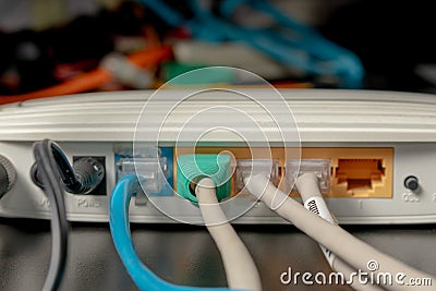 Network cable connects to wireless router router internet global network Stock Photo