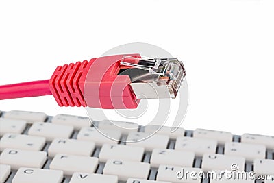 Network cable on keyboard Stock Photo