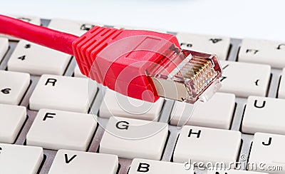 Network cable on keyboard Stock Photo