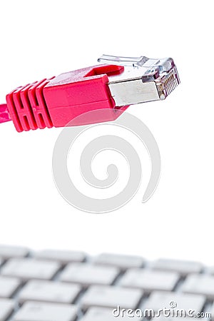 Network cable to keyboard Stock Photo