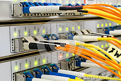 The network cables are connected to the main server. The front panel of the supercomputer located in the server room of the data Stock Photo