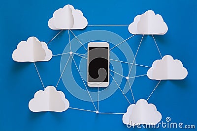 Data communications and cloud computing network concept. Smart phone flying on paper cloud. Stock Photo