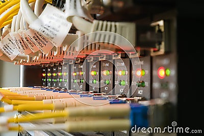 Network connection device with network switch, Ethernet router, Ethernet cables, fiber optic cables and status LEDs Stock Photo
