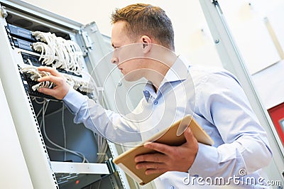 Network engineer admin at data center Stock Photo