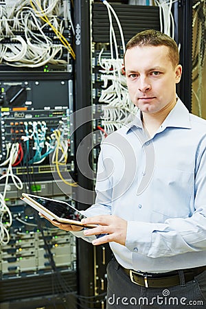 Network engineer admin at data center Stock Photo