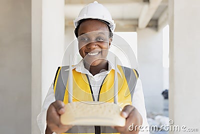 Network engineer hand holding wireless wifi access point internet router happy smiling for professional setup install right Stock Photo