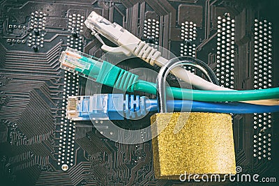 Network ethernet cables in padlock on computer motherboard. Internet data privacy information security concept. Toned image Stock Photo