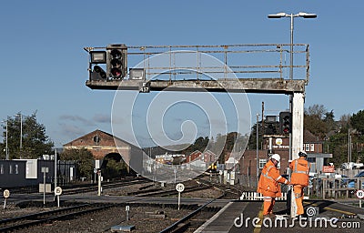 Network rail workers work on a signal gantry Editorial Stock Photo