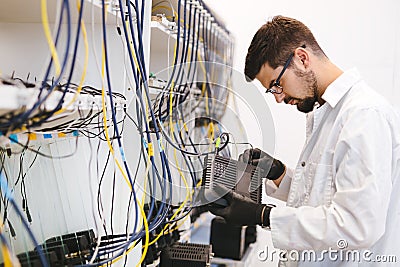 Network technician testing modems Stock Photo