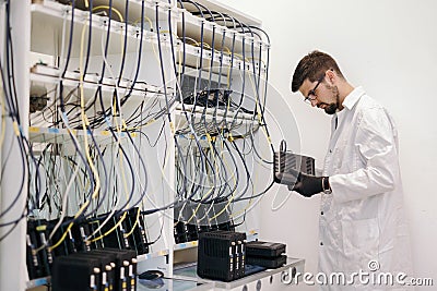 Network technician testing modems Stock Photo