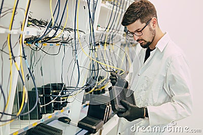 Network technician testing modems Stock Photo