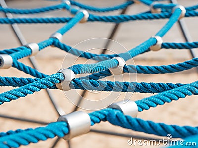 Networked ropes on climbing frame Stock Photo