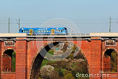 Netzschkau, Germany - April 30, 2023: Vogtland regional train crosses the Goltzsch Viaduct, the largest brick-built railway bridge Editorial Stock Photo